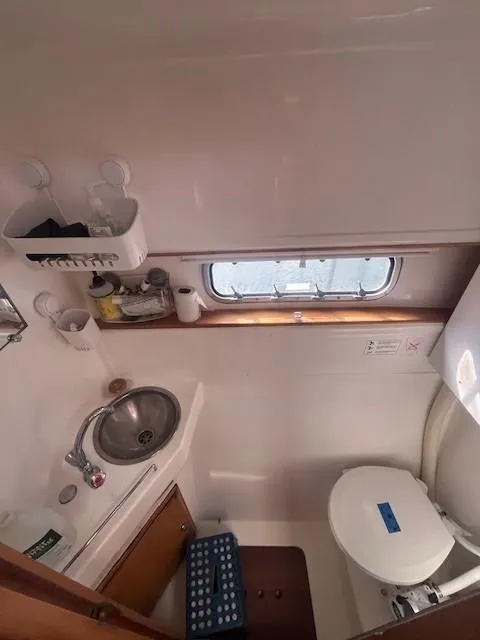 Slide: The Image of 2011 Nautitech 402 yacht bathroom with sink, toilet, and window. - 37