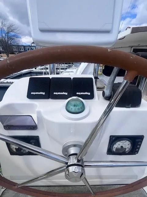 Slide: The Image of Steering wheel and controls of a 2011 Nautitech 402 catamaran. - 41
