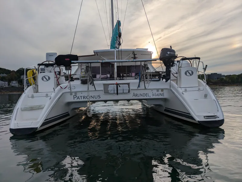 Slide: The Image of Nautitech 402 catamaran, 2011 model, docked on calm water at sunset. - 45