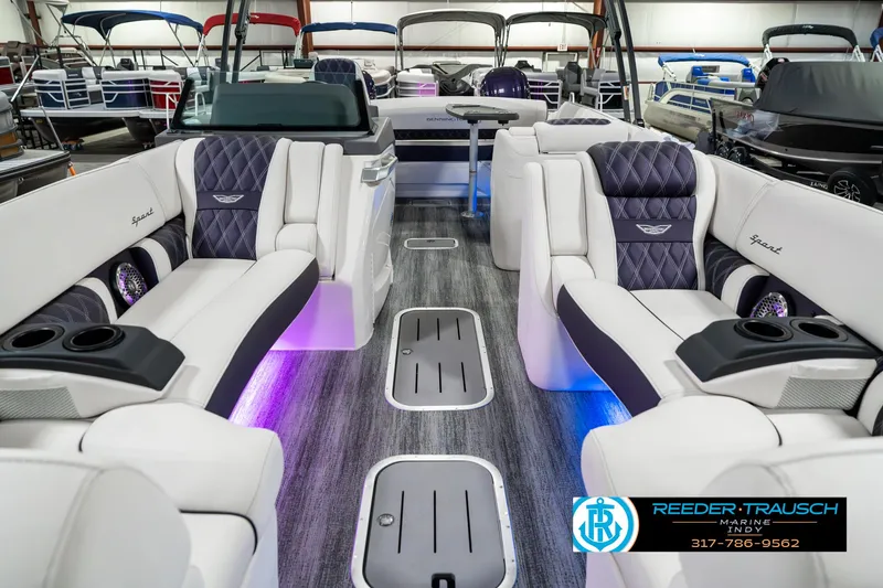 Slide: The Image of 2025 Bennington QX SB T2 luxury boat interior with plush seating and ambient lighting. - 16