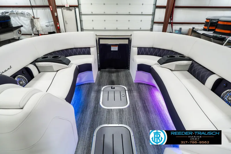 Slide: The Image of 2025 Bennington QX SB T2 boat interior with LED lighting and luxury seating. - 21