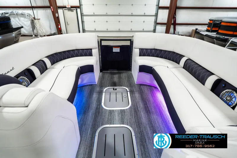 Slide: The Image of 2025 Bennington QX SB T2 boat interior with luxury seating and ambient lighting. - 22