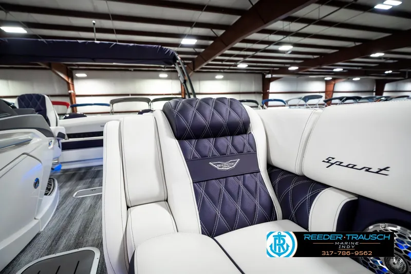 Slide: The Image of 2025 Bennington QX SB T2 luxury boat interior with quilted seats in showroom. - 26