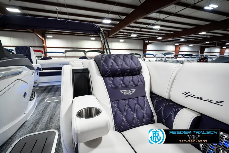 Slide: The Image of Luxurious interior of 2025 Bennington QX SB T2 boat with plush seating and cup holder. - 27