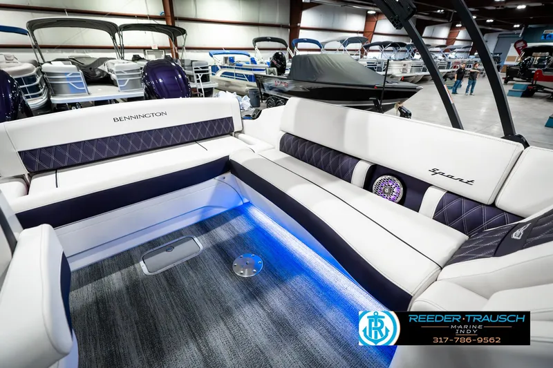 Slide: The Image of 2025 Bennington QX SB T2 boat interior with elegant seating and ambient lighting. - 30