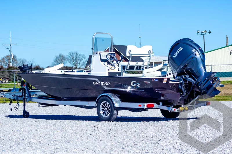 Slide: The Image of 2025 G3 Bay 21 GX boat with Yamaha outboard motor on a trailer. - 10