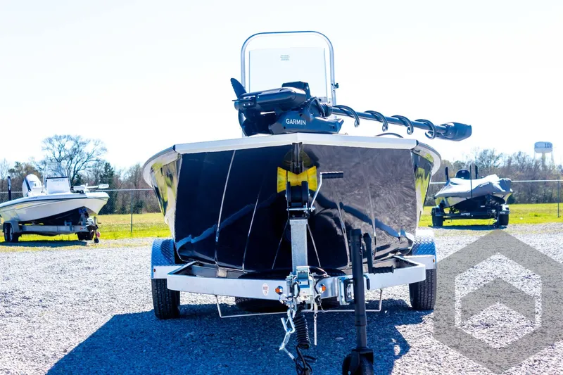 Slide: The Image of 2025 G3 Bay 21 GX boat on trailer, front view, parked outdoors. - 13