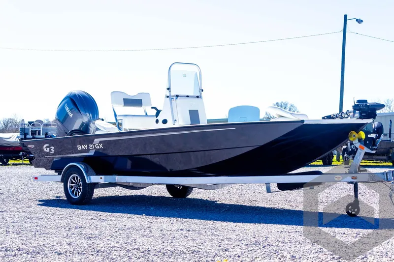 Slide: The Image of 2025 G3 Bay 21 GX boat on trailer, side view, outdoors. - 14