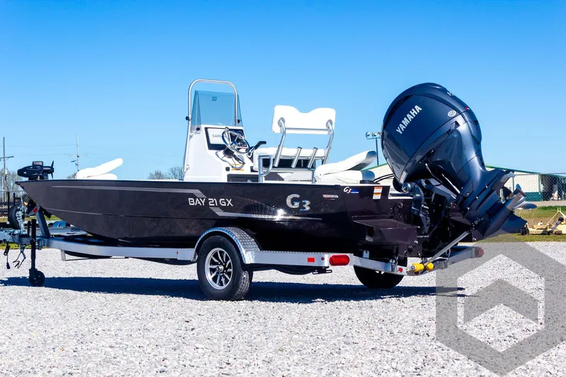 Slide: The Image of 2025 G3 Bay 21 GX boat with Yamaha engine on a trailer. - 18