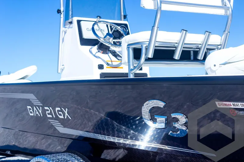 Slide: The Image of 2025 G3 Bay 21 GX boat, sleek design, close-up view, blue sky background. - 21