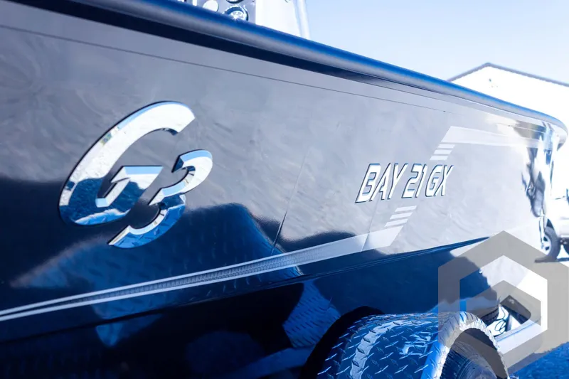 Slide: The Image of 2025 G3 Bay 21 GX boat side view with logo and model name. - 24