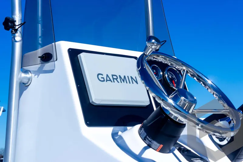 Slide: The Image of Steering console of 2025 G3 Bay 21 GX boat with Garmin navigation system. - 28