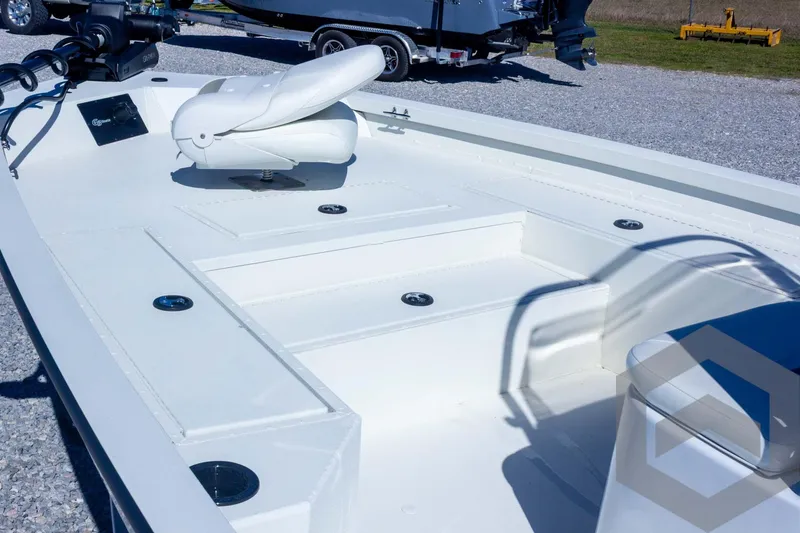 Slide: The Image of 2025 G3 Bay 21 GX boat interior with seating and storage compartments. - 29