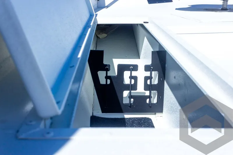 Slide: The Image of 2025 G3 Bay 21 GX boat storage compartment with metal brackets. - 30