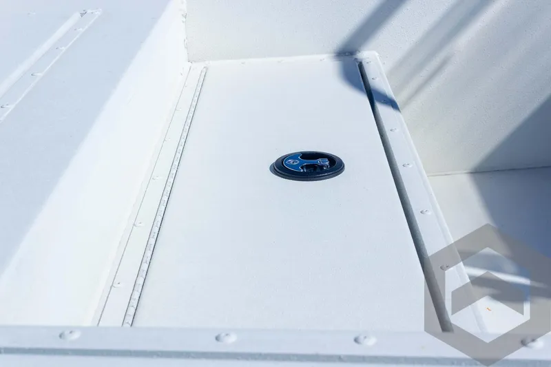 Slide: The Image of 2025 G3 Bay 21 GX boat deck with storage compartment and latch. - 33