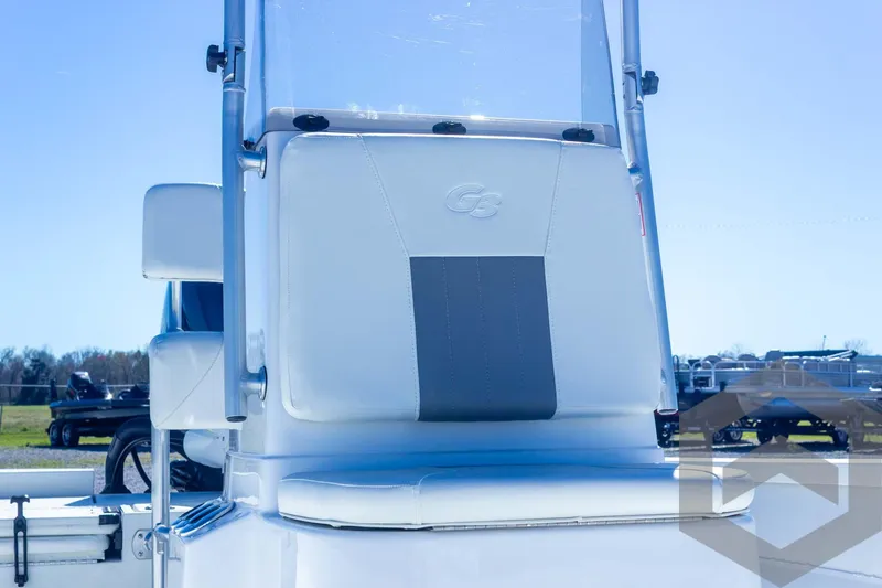 Slide: The Image of 2025 G3 Bay 21 GX boat seat, white and gray, outdoor setting. - 38