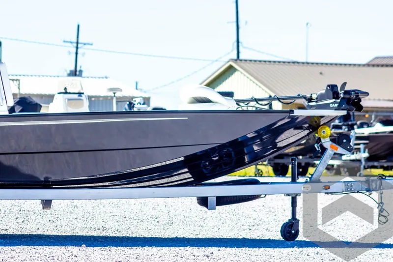 Slide: The Image of 2025 G3 Bay 21 GX boat on trailer, side view, outdoor setting. - 4