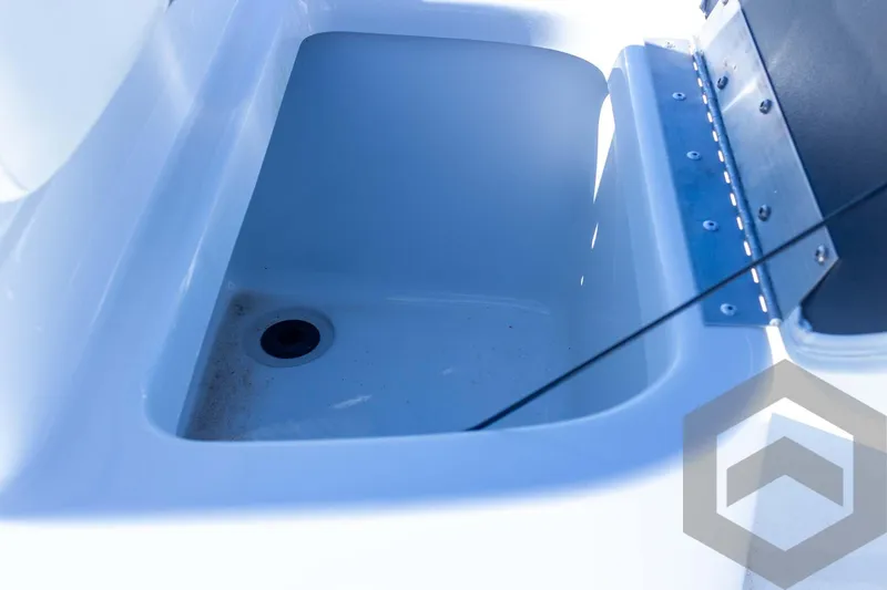 Slide: The Image of 2025 G3 Bay 21 GX boat storage compartment with drain hole. - 40