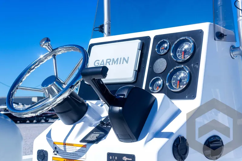 Slide: The Image of 2025 G3 Bay 21 GX boat dashboard with Garmin navigation system and gauges. - 43
