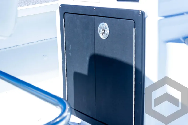 Slide: The Image of Storage compartment on 2025 G3 Bay 21 GX boat, featuring sleek black door. - 44