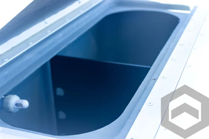 Slide: The Image of 2025 G3 Bay 21 GX boat storage compartment, open lid, interior view. - 48