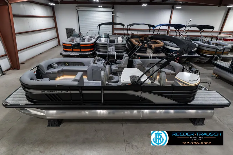 Slide: The Image of 2025 Bennington 23 LPD pontoon boat in showroom, side view. - 1