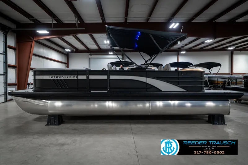 Slide: The Image of 2025 Bennington 23 LPD pontoon boat in a showroom, side view. - 11