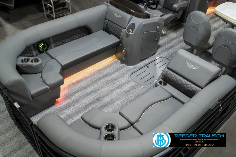 Slide: The Image of 2025 Bennington 23 LPD boat interior with luxurious seating and ambient lighting. - 12