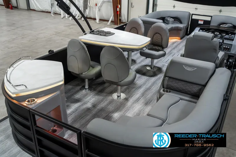 Slide: The Image of 2025 Bennington 23 LPD pontoon boat interior with modern seating and table setup. - 14