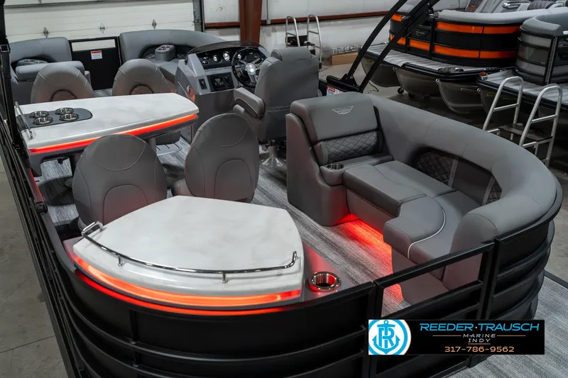Slide: The Image of 2025 Bennington 23 LPD pontoon boat interior with modern seating and ambient lighting. - 15