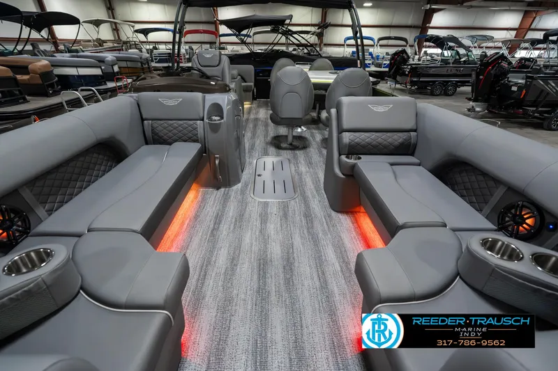 Slide: The Image of 2025 Bennington 23 LPD pontoon boat interior with gray seating and ambient lighting. - 16