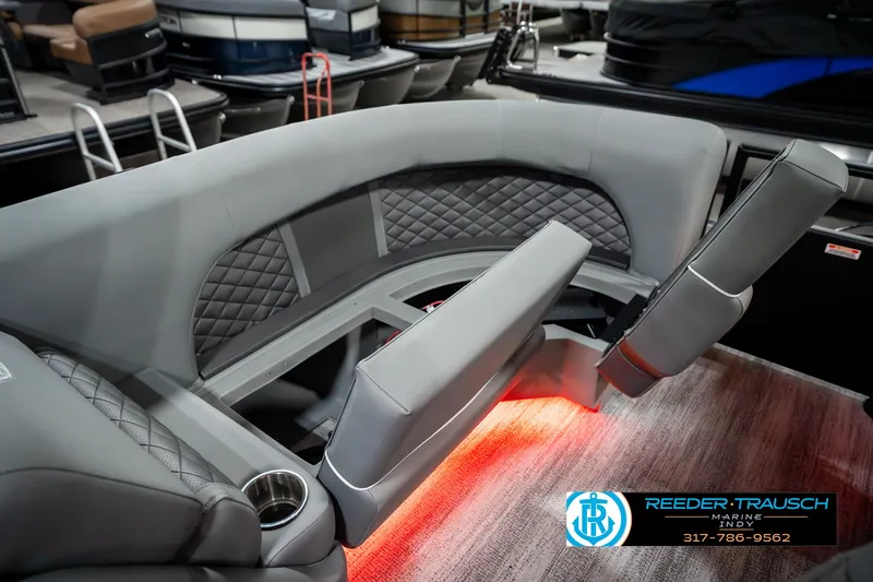 Slide: The Image of 2025 Bennington 23 LPD boat interior with gray seating and ambient lighting. - 27