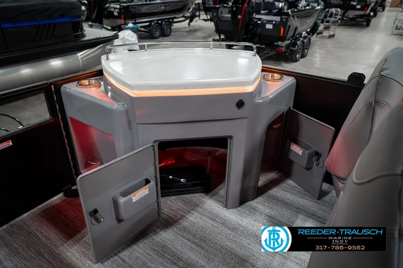 Slide: The Image of 2025 Bennington 23 LPD boat interior with illuminated bar and storage compartments. - 29