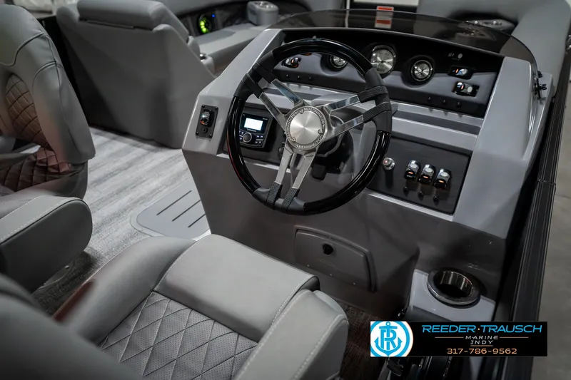 Slide: The Image of 2025 Bennington 23 LPD boat interior with modern steering console and luxurious seating. - 30