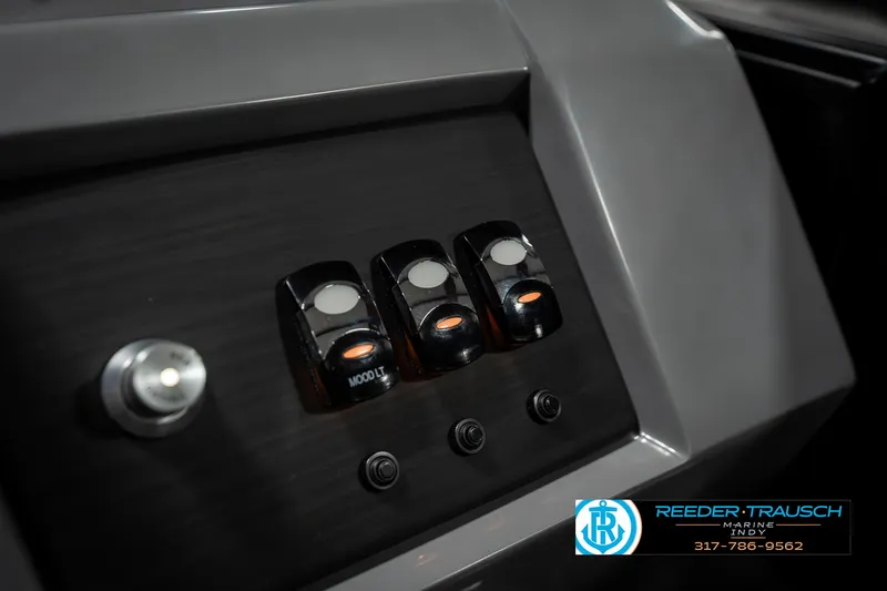 Slide: The Image of Control panel of 2025 Bennington 23 LPD boat with switches and buttons. - 37
