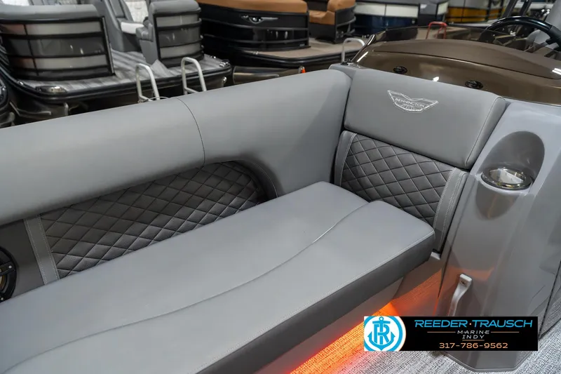 Slide: The Image of 2025 Bennington 23 LPD boat interior with gray quilted seating and cup holder. - 40