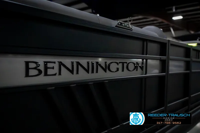 Slide: The Image of 2025 Bennington 23 LPD boat side view with logo in showroom lighting. - 48