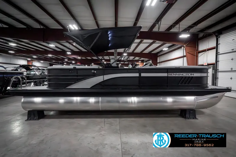 Slide: The Image of 2025 Bennington 23 LPD pontoon boat in showroom, side view. - 7