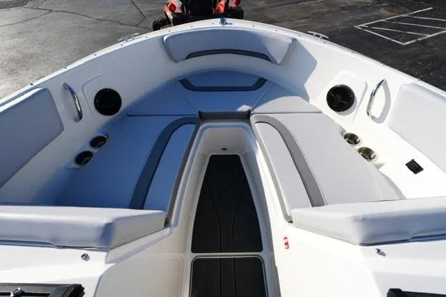 Slide: The Image of 2025 Bayliner V20 boat interior with cushioned seating and sleek design. - 10