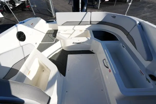 Slide: The Image of 2025 Bayliner V20 boat interior with spacious seating and storage compartments. - 17