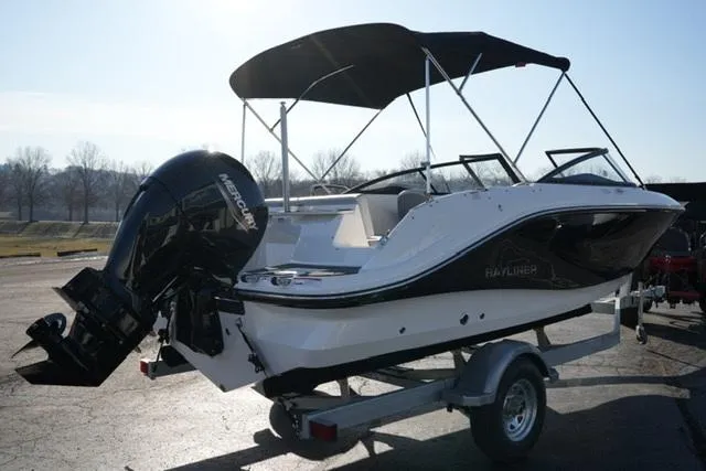 Slide: The Image of 2025 Bayliner V20 boat on trailer with canopy and outboard motor. - 6