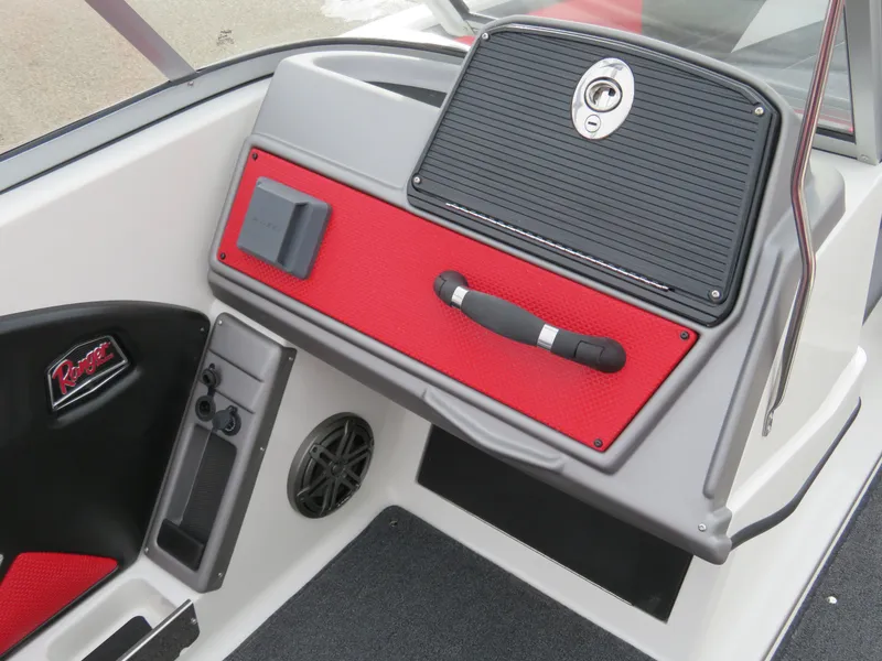 Slide: The Image of 2025 Ranger 1850MS boat interior with red accents and storage compartment. - 10