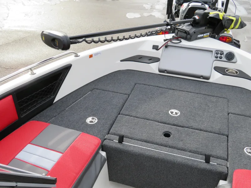 Slide: The Image of 2025 Ranger 1850MS boat interior with red and gray seating, storage compartments, and control panel. - 11