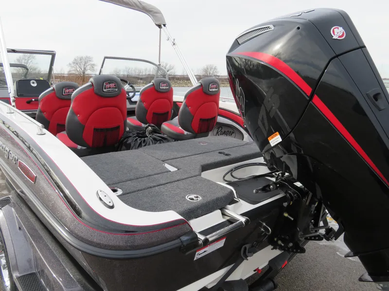 Slide: The Image of 2025 Ranger 1850MS boat with red seats and powerful outboard motor. - 4