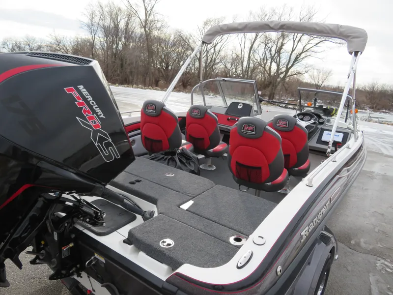 Slide: The Image of 2025 Ranger 1850MS boat with Mercury Pro XS engine, featuring red and black seating. - 5