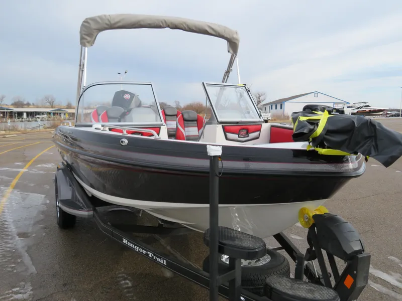 Slide: The Image of 2025 Ranger 1850MS boat on trailer, featuring sleek design and red interior accents. - 6