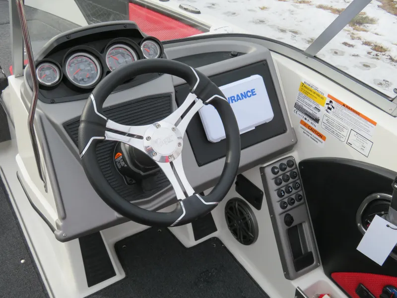 Slide: The Image of 2025 Ranger 1850MS boat dashboard with steering wheel and control panel. - 7