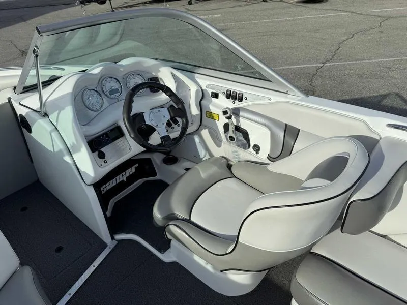 Slide: The Image of 2017 Sanger V215 XTZ boat interior with steering wheel and dashboard controls. - 10