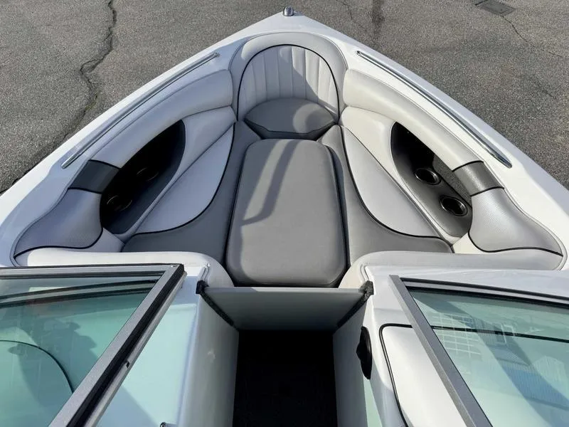 Slide: The Image of 2017 Sanger V215 XTZ boat interior with gray seating and cup holders. - 13
