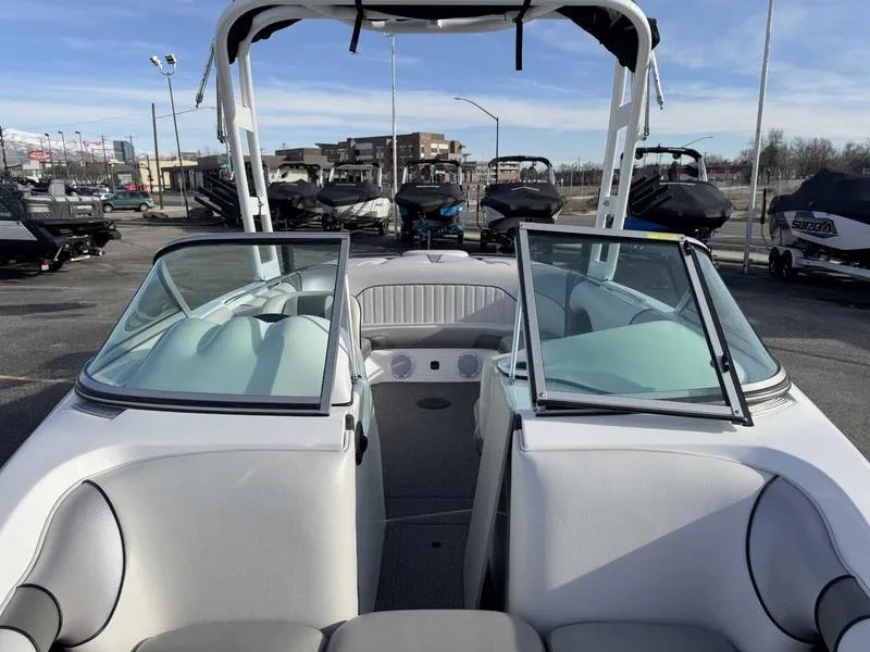 Slide: The Image of 2017 Sanger V215 XTZ boat interior with open bow seating and windshield. - 14